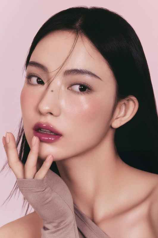 Bright living room with books stacked on table